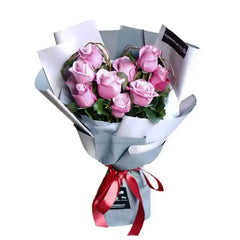Bouquet mawar pink cantik dari online florist, dikemas rapi dengan pita merah