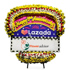 Bunga papan anniversary Lazada dari online florist FlowerAdvisor, dekorasi bunga kuning putih merah elegan