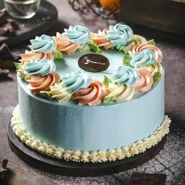 Kue ulang tahun cantik dengan hiasan bunga krim warna pastel, online florist