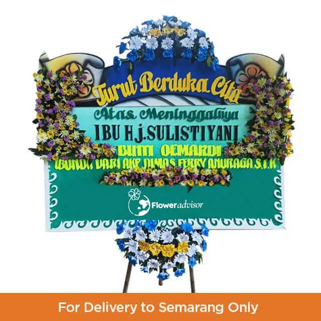 Karangan bunga duka cita online florist untuk pengiriman ke Semarang, rangkaian bunga berwarna biru kuning dengan pita ucapan