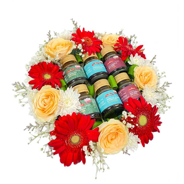 Bunga segar dengan botol saus, kirim dari online florist terpercaya untuk hadiah istimewa